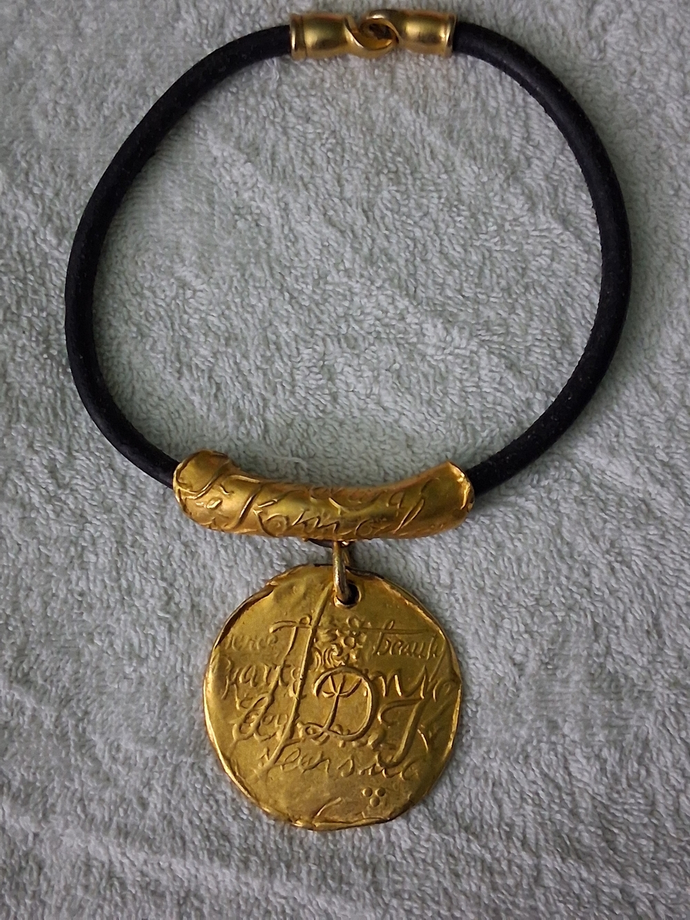 Vintage Donna Karan Black Leather Necklace with Gold Engraved Medallion